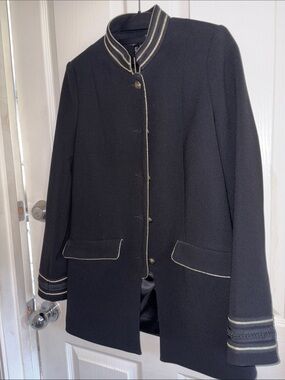 Black tailor jacket, braided in gold with padded shoulders